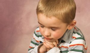 Young boy with short hair and beautiful facial expressions